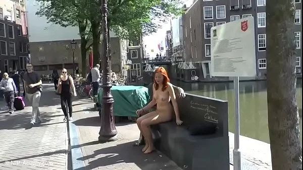 Pretty redhead walking naked in Amsterdam